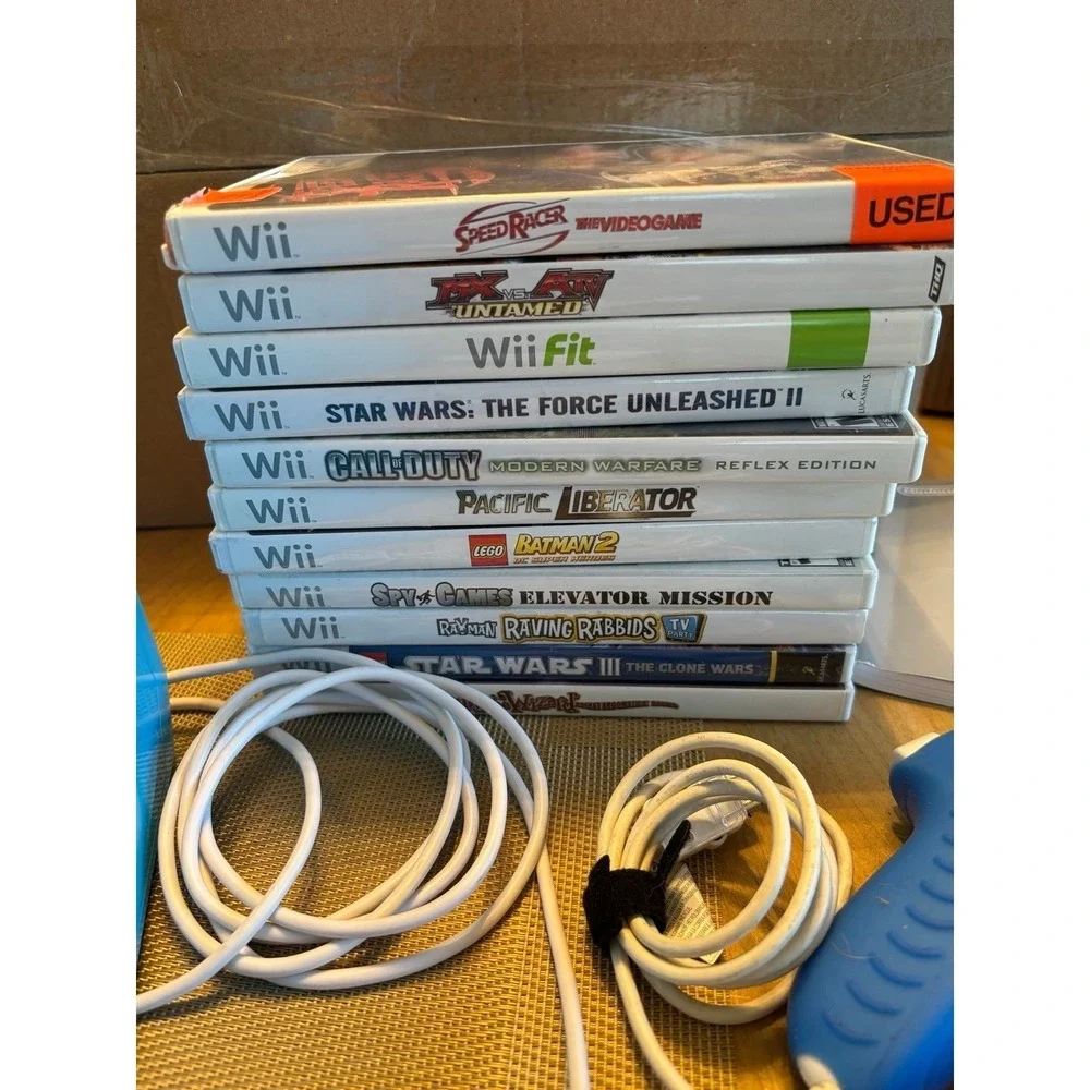 Nintendo Wii. Rare blue limited edition console bundle with Wii box. Many games